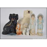 A collection of 19th and 20th ceramics to include Staffordshire flatbacks / dogs,