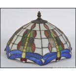 A 20th century Tiffany style leaded marbled and stained glass ceiling light shade along with