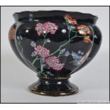 A 20th century Wood & Sons ' Formosa ' Staffordshire planter having black ground with foliate
