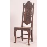 A 19th century Jacobean revival carved oak hall chair having cabriole legs with stretchers under