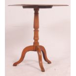 A 19th century mahogany tilt top ( fixed ) wine table / occasional table being raised on splayed