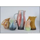 A collection of art deco and later ceramic jugs by Sylvac,