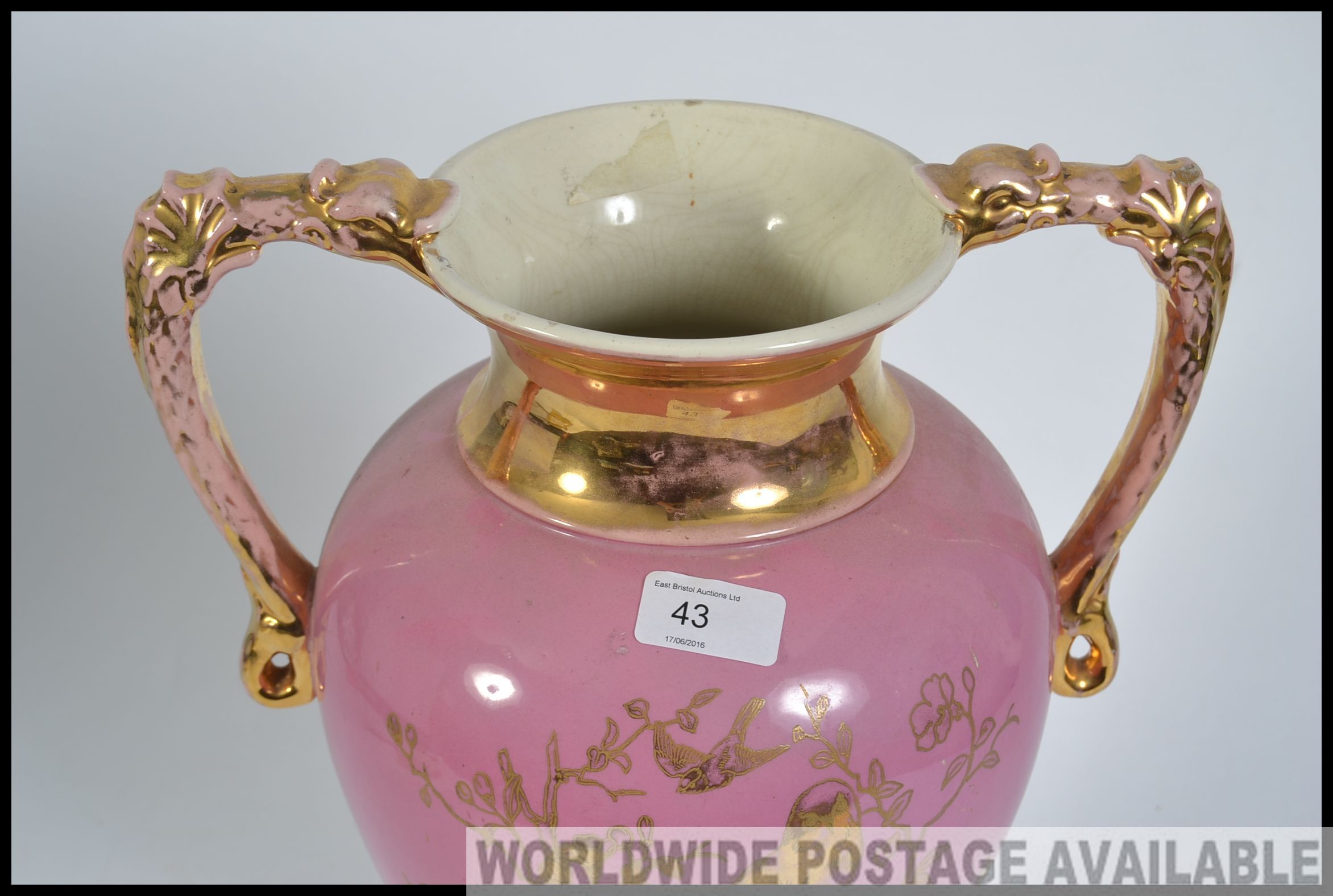 A large twin handled Victorian Staffordshire campana vase having pink ground with gilded details of - Image 2 of 4