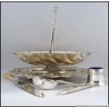 A collection of silver plate to include a rococo dish, bon bon basket,