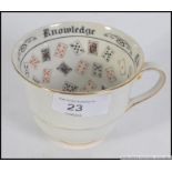 A vintage 20th century fortune tellers porcelain teacup - cup with decorative glazed inner and
