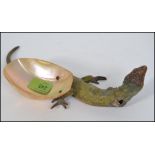A stunning early 20th Century cast metal cold painted model of a lizard,