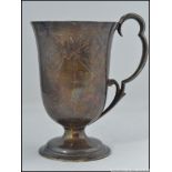 An early Victorian silver hallmarked ladies goblet / vessel having scrolled handle with rococo