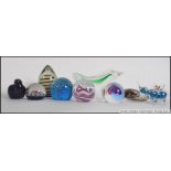 A collection of glass paperweights from the 20th century to include a Mdina, Millefiori,