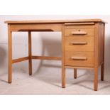 A vintage 1930's Air Ministry type oak pedestal desk having open kneehole recess with raised bank