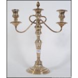 A 20th century silver plated three sconce candle stick. Measures: 41cm H.