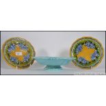 2 Majolica ceramic glazed plates together with a blue glazed tazza by Villeroy & Boch,