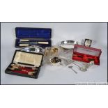 A good collection of vintage silver plate items to include cased flatware, ladles,