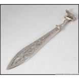 A silver 800 marked continental book mark having Romulus and remus adorned top with pierced blade.