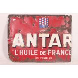 A large early 20th century French enamel advertising sign for Antar having red ground with notation.