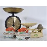 A set of vintage Salter kitchen scales along with a vintage set of Harper balance scales along with