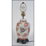 A Japanese ceramic chrysanthemum ginger jar converted into a lamp.