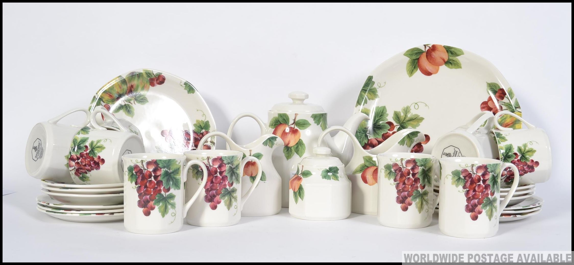 A Royal Doulton ' Vintage Grape ' pattern tea service comprising the teapot, cups,