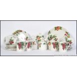 A Royal Doulton ' Vintage Grape ' pattern tea service comprising the teapot, cups,