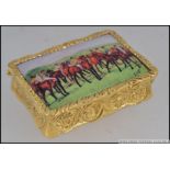 A gold plated over silver pill / snuff box with pictorial Horse racing enamel scene lid.