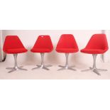 A set of 4 1970's Maurice Burke for Arkana red vinyl and polished chrome swivel dining chairs