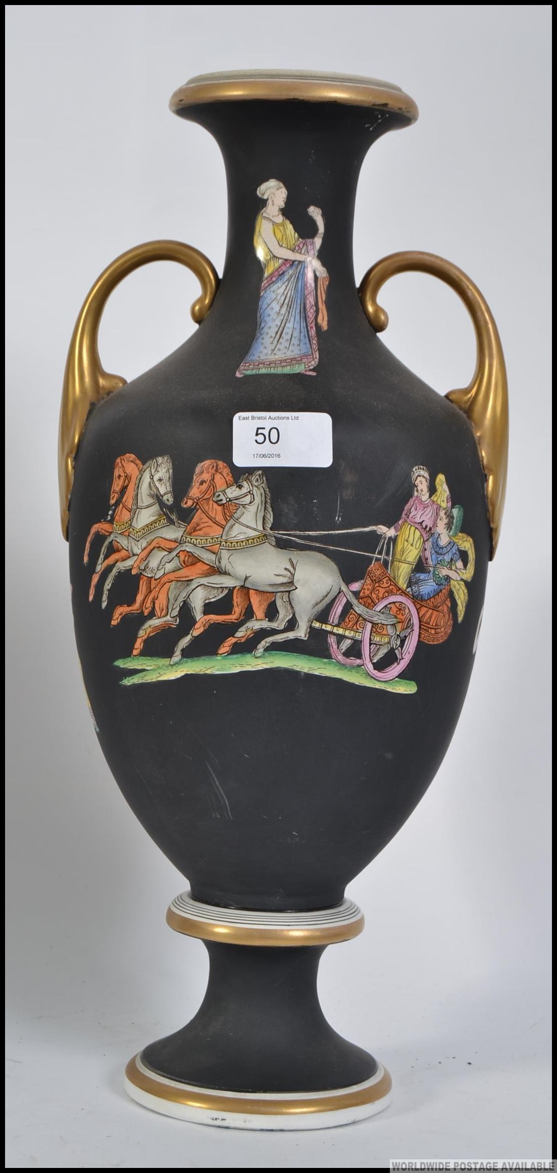 A Victorian terracotta twin handled amphora vase having black ground and transfer printed with