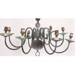 A 20th century vintage brass chandelier having multiple arms with central ball finials,