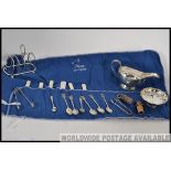 A collection of silver plated wares to include creamer, bon bon dish, silver plate toast rack,