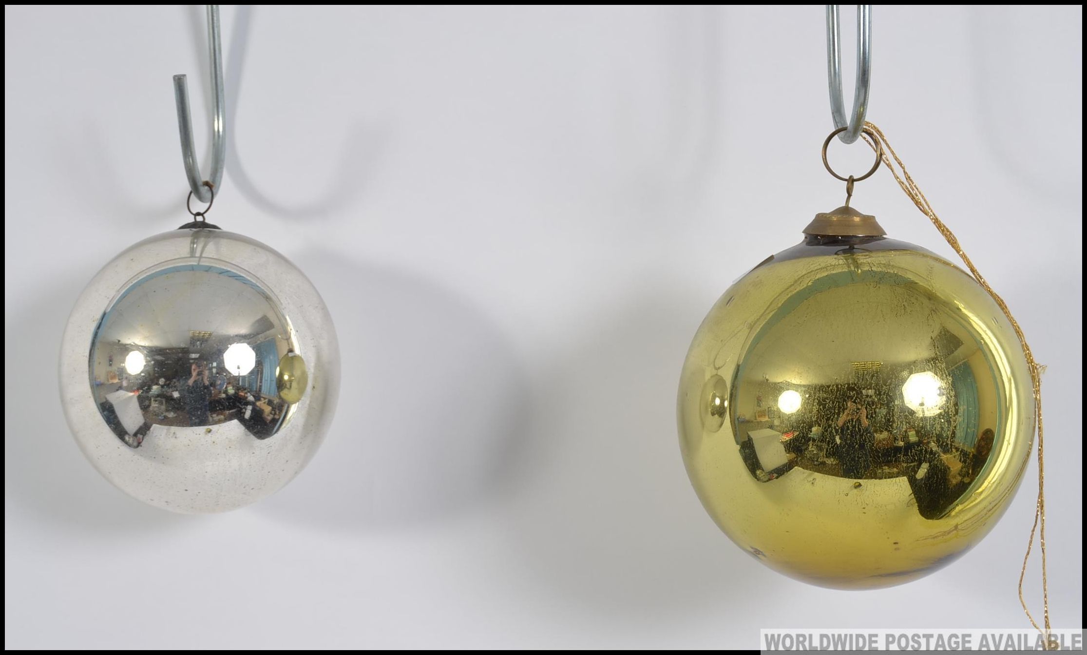 2 vintage 20th century coloured glass witch balls to include a large gold example and a smaller