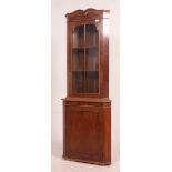 A Georgian style mahogany corner cabinet with upper astragal glazed door above single cupboard