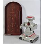 A collectable remote control R.A.D robot, a Star Wars comm talk and a Past Times bagatelle board.