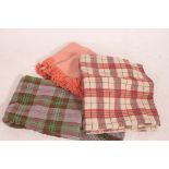 A collection of vintage 20th century picnic woollen rugs to include tartan,