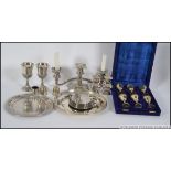 A mixed lot of silver plate to include salt and pepper condiments, trays, 2 medium sized goblets,