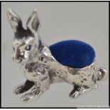 A silver ( stamped 925 ) pincushion in the form of a crouching alert rabbit / Hare,