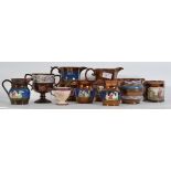 A collection of approximately 9 pieces of Victorian lustre and stone glazed jugs,