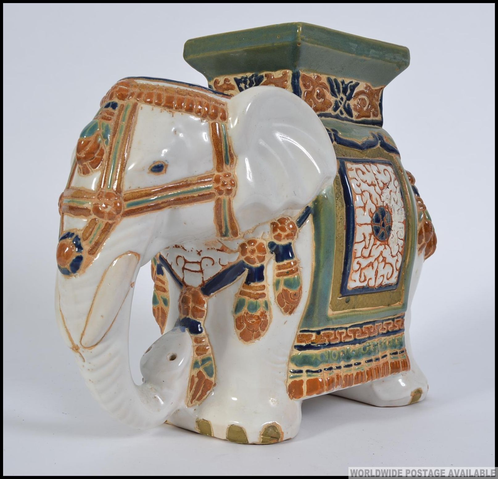 A 20th century large Chinese ceramic planter / stool in the form of an Elephant. Measures: 27cm H.