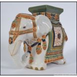 A 20th century large Chinese ceramic planter / stool in the form of an Elephant. Measures: 27cm H.