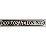 A cast iron ' Coronation Street ' wall sign. Black and white, with raised lettering. 63cm long.