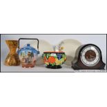 A collection of items to include a hand painted bowl, biscuit barrel, a deco Wade jug,