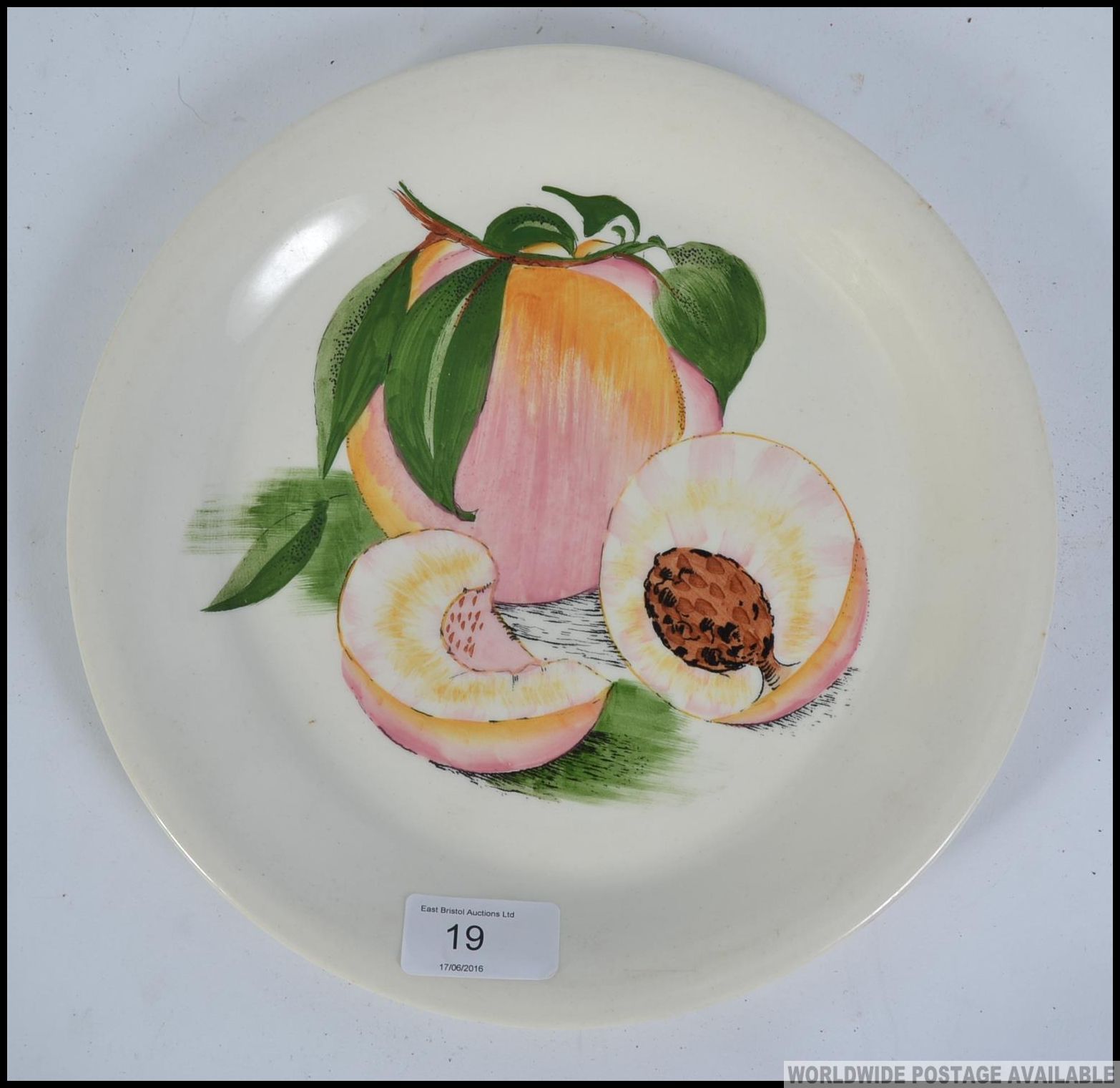 A hand painted Sunkissed Royal Staffordshire Dinnerware plate by Clarice Cliff,