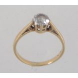 A hallmarked 9ct gold ring with single clear stone in a prong setting approx 75pts.