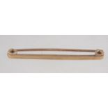 A 9ct gold tie bar pin. Marked HG&S 9ct. Tests 9ct gold. Measures 4cms. Weighs 1.