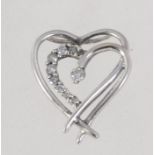 A 9ct white gold and diamond pendant in a heart form with channel set diamonds approx 10pts .