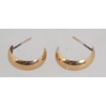 A pair of 9ct gold hoop earrings with post backs. Marked 375 to body, tests 9ct gold. Measures 1.