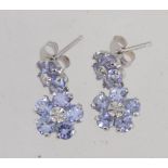 A pair of 10ct white gold tanzanite and diamond drop earrings set with diamonds and tanzanite in a