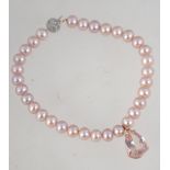 A 9ct gold and pearl bracelet with a diamond chip encrusted 9ct white gold ball clasp with rose