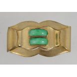 A 1930's Art Deco Czech yellow metal brooch pin set with two jade peking glass arcs with a trombone