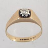 A hallmarked 9ct gold and diamond ring set with a single diamond in a star setting approx 5pts.