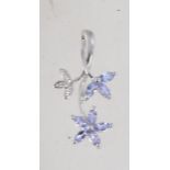 A hallmarked 9ct white gold tanzanite and diamond drop pendant set with diamonds and tanzanite in a