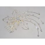 A large vintage white metal hair comb with star burst rhinestone decoration. Measure 10cms.