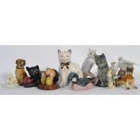 A collection of animal porcelain figurines to include cats , owls , dogs , swans etc.